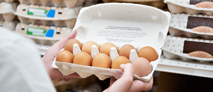 A consumer shopping for a dozen eggs.