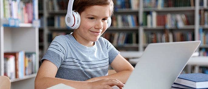 A young boy using laptop