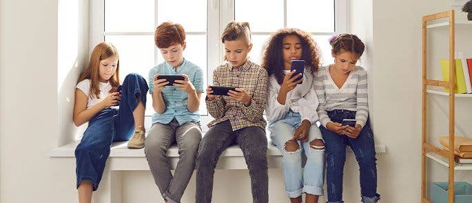 A group of children on their phones