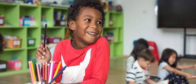 Young child learning in school