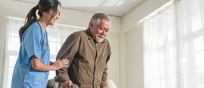 caregiver helping a man 