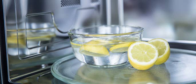 Bowl of lemons in water in a microwave