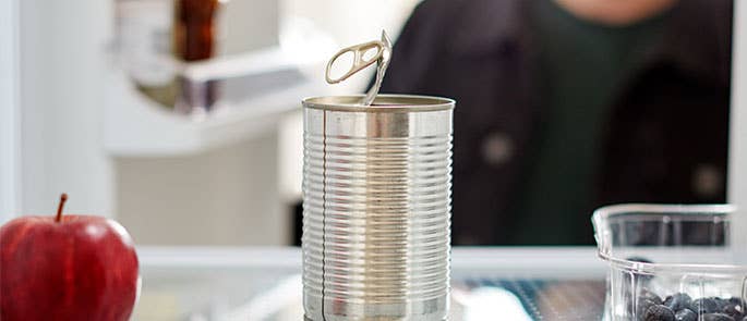 partly opened foods such as an open tin of food and open berries improperly stored on fridge shelf