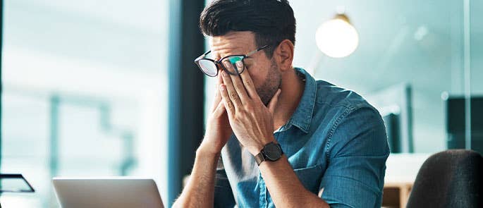 person being visibly stressed by peer pressure at work