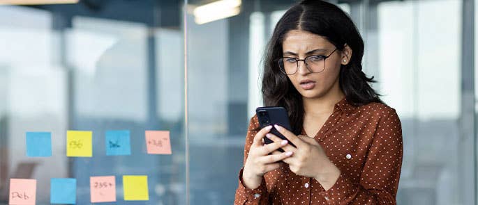 person at work being peer pressured over text