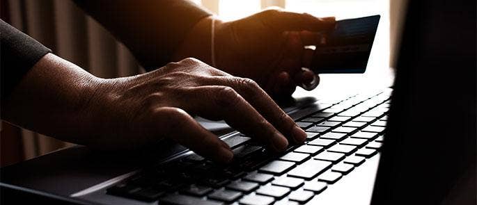 Someone accessing bank details on the computer