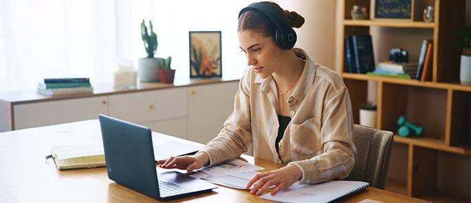An employee taking part in a virtual session on their laptop