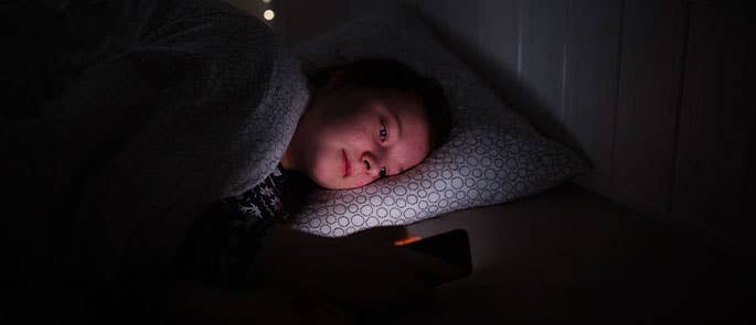 Young girl texting on her phone