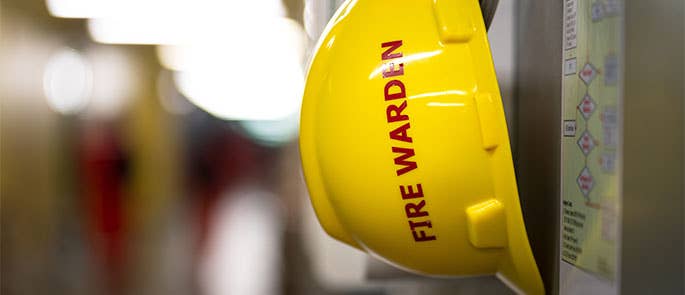 Fire warden safety hat in the workplace 