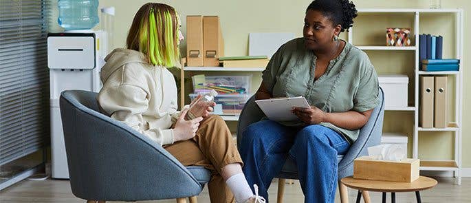 A social worker with a teenager