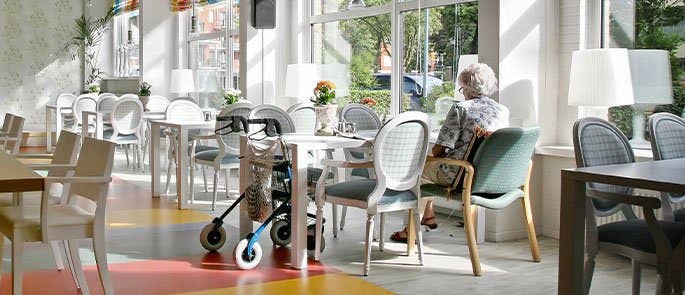 Service user sitting alone in a care home