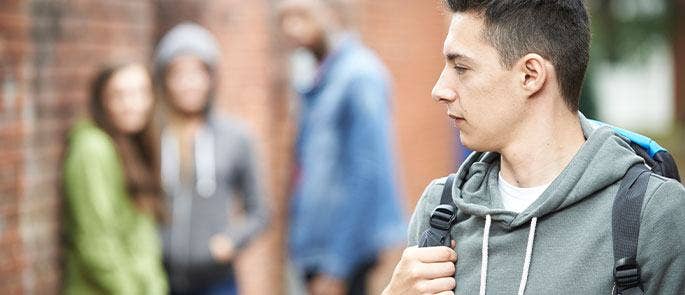 A teenage boy feeling anxious and intimidated 