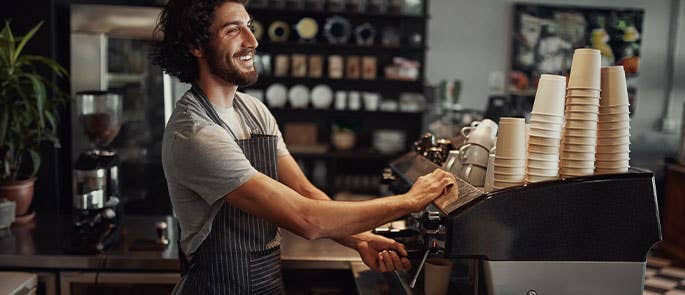 barista in cafe making a coffee