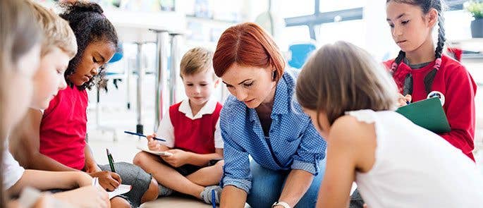 Teacher working with a focus group in the classroom