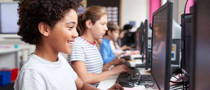 students on computers in the classroom