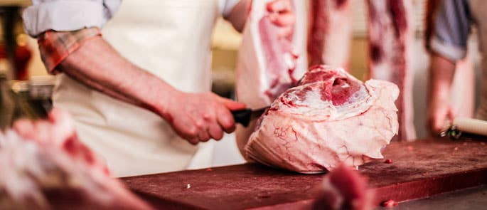 butcher chopping meat 