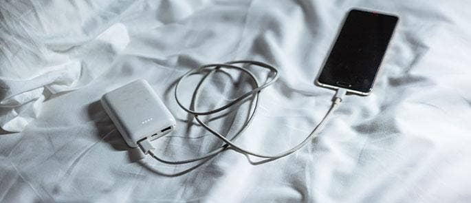 Portable charger on the bed