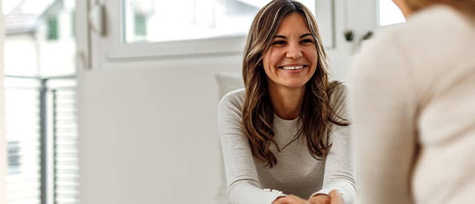 Woman showing signs of positive thinking patterns and positive mental health