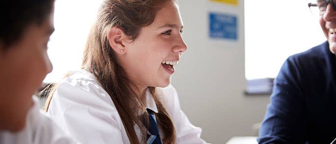Students laughing with teacher