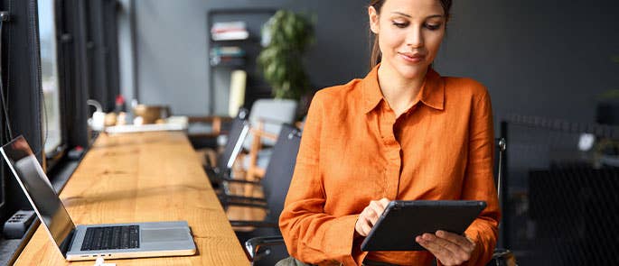 Businesswoman using laptop and technology for AI in business