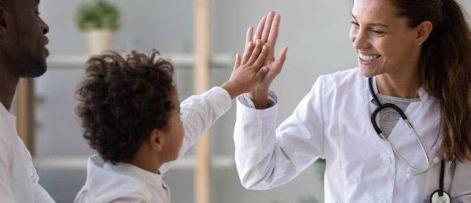 healthcare professional high-fiving child
