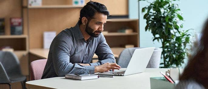 Teacher sitting in the staff room at school