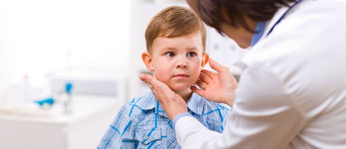 nursery nurse with child doing a check