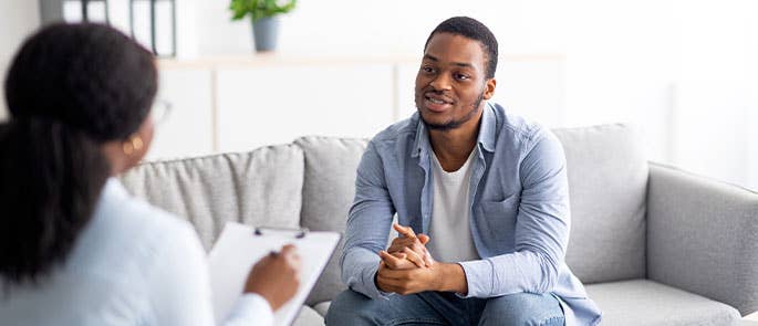 Health and social care worker talking to and getting feedback from patient or patients family member