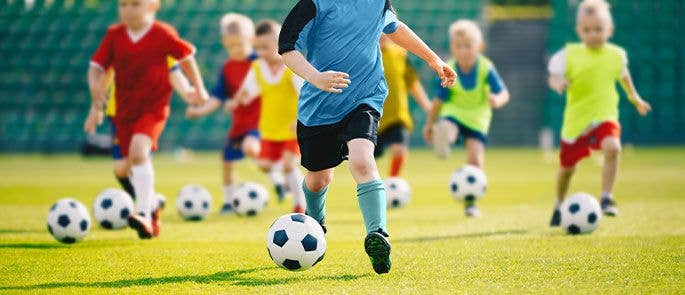 Primary school children taking part in football club