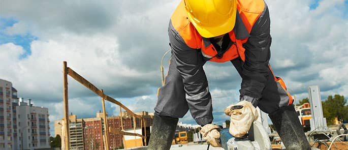 builder using equipment at work