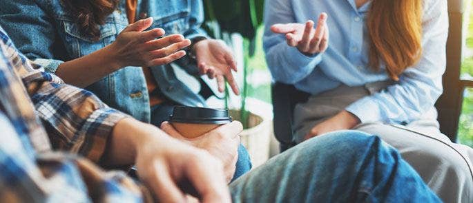 Employees having a discussion in the workplace