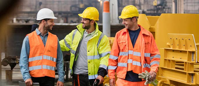 three labourers on site in PPE