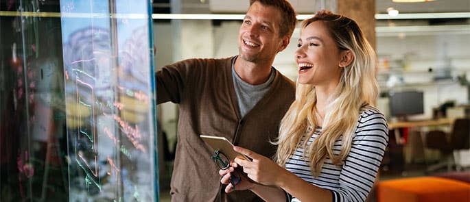 2 coworkers working together as 'buddies'