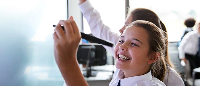 children happy doing work on board in a pair