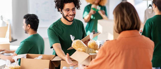 Individual doing charity work at food bank