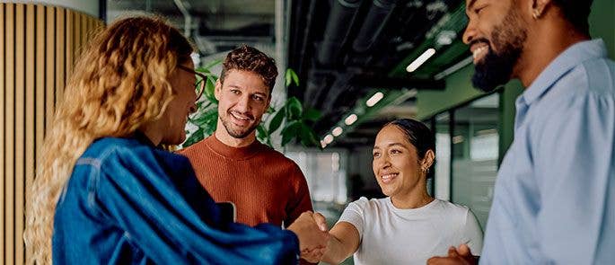 Colleagues welcoming a new employee