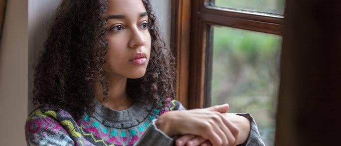 Girl sat in the window