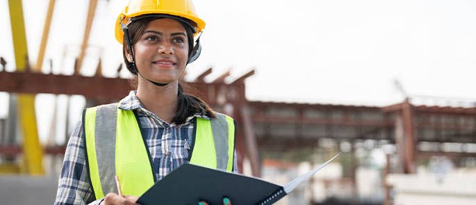 civil engineer on site with clipboard