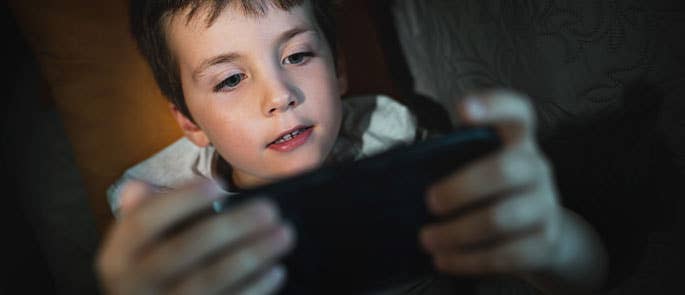 child scrolling on phone