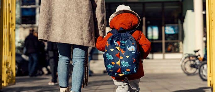 Child walking with a carer