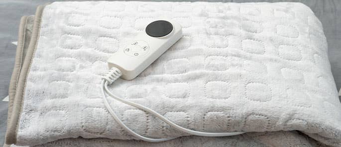 electric blanket folded up on bed