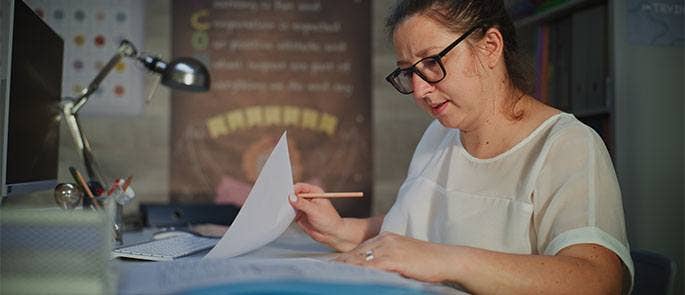 Teacher looking through documents